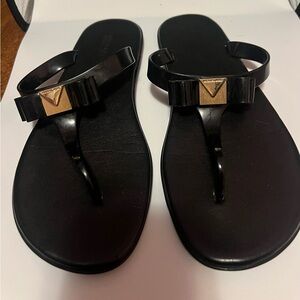 Michael Kors Black and Gold Sandals with T-Strap Design